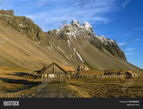 Wooden Houses In Vikings Village Near Snow Mountains In Vestrahorn