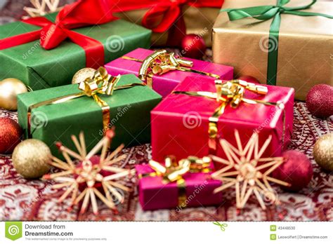 Check out our xmas presents selection for the very best in unique or custom, handmade pieces from our ornaments shops. Xmas Presents With Bows, Baubles And Stars Stock Photo ...