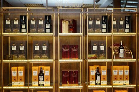 A wide variety of whiskey bottles display. High Quality China Wholesale Commercial Merchandising Wall ...