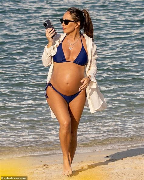 Pregnant Lauryn Goodman Shows Off Her Baby Bump In A Navy Bikini On The Beach In Dubai All Football