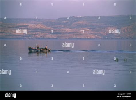 Photograph Of Fishermen In The Sea Of Galilee Stock Photo Alamy