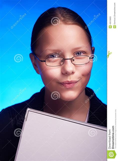 Young Student In Eyeglasses Holds Folder And Smiling Stock Image