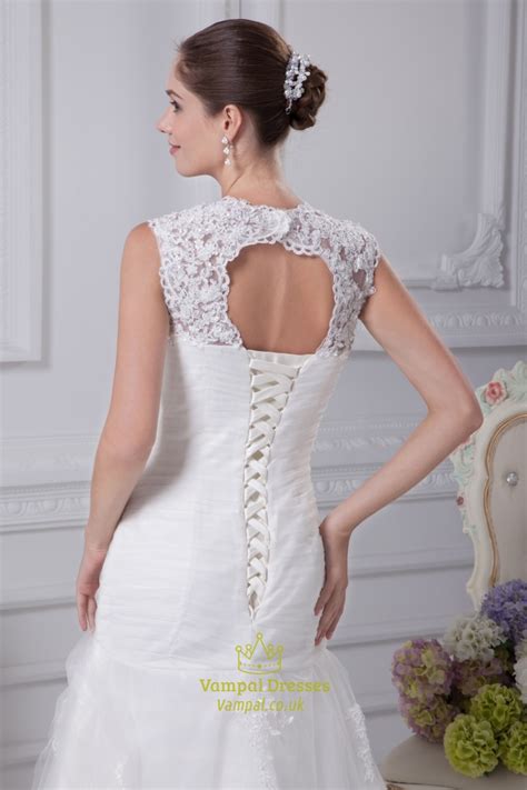 The absolute largest selection of fashion clothing the midsection of the dress has a gathered texture that extends to the asymmetrical tiers of the skirt. Mermaid Wedding Dress With Cap Sleeves, Pleated Mermaid ...