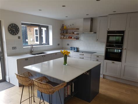 Grey kitchen cabinets in rustic industrial decor Firgrove Collection shaker style kitchen. Contrasting grey cabinets with the blue finish on the ...