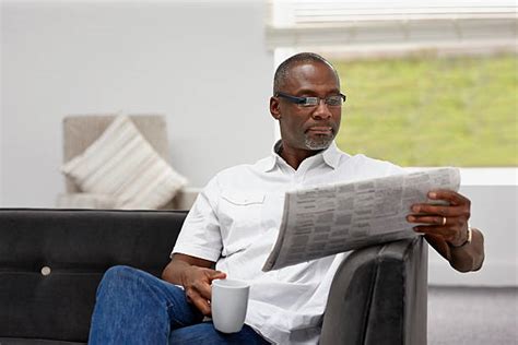 Man Reading Newspaper Pictures Images And Stock Photos Istock
