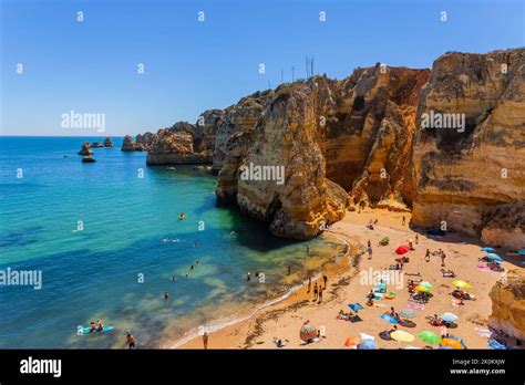 Lagos, Portugal - 25 August 2022: People at Dona Ana beach at Algarve