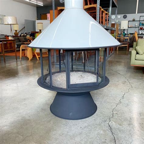 This unit is very heavy, and is lined with 1.5″ ceramic blocks for insulation. White Mid Century Modern Malm Carousel Fireplace | Chairish
