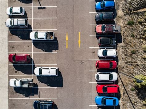 Image Of Aerial Shot Of Cars Parked In Carpark With Empty Spaces