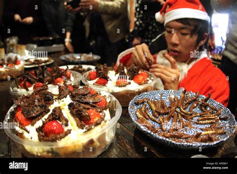Tokyo Japan 24th Dec 2016 A Man Puts Chocolate Covered Mealworms On