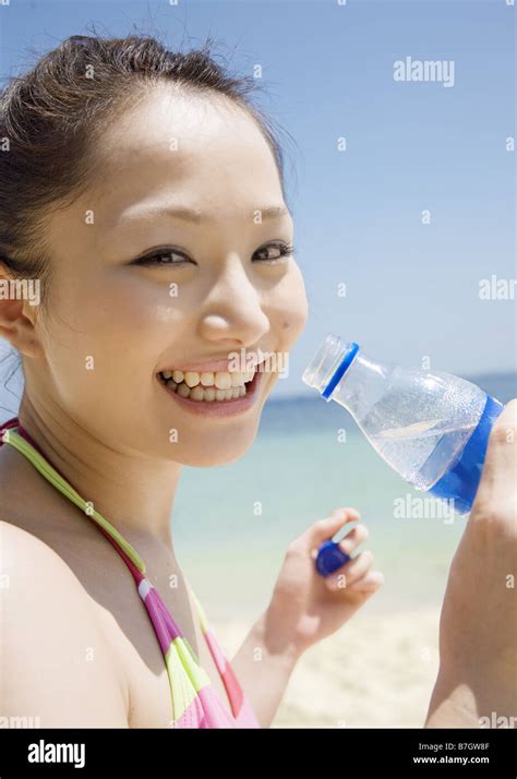 Woman Drinking Mineral Water Stock Photo Alamy