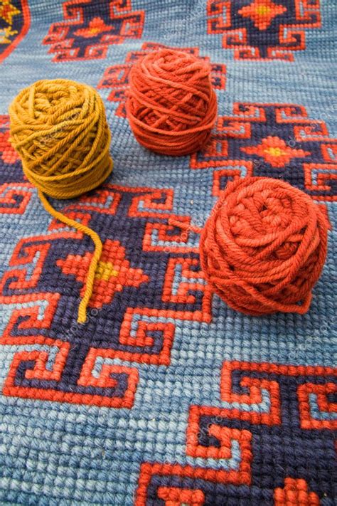 Balls Of Wool Over Knitting Carpet — Stock Photo © Peresanz 1821732