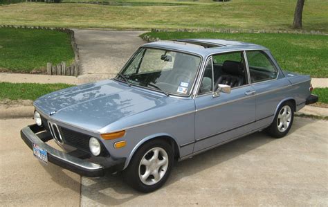 A unique feature about this model was the '2002 turbo' words inscribed in reverse on the front spoiler, so the drivers in front of it would know what they were dealing with when looking in their mirrors. 1975 BMW 2002 | AskAutoExperts.com