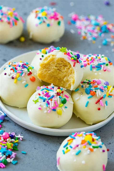 One by one, dunk the cake pops in the melted chocolate, shake off the excess, and sprinkle with nonpareils. A recipe for cake balls that uses cake mix, frosting and ...