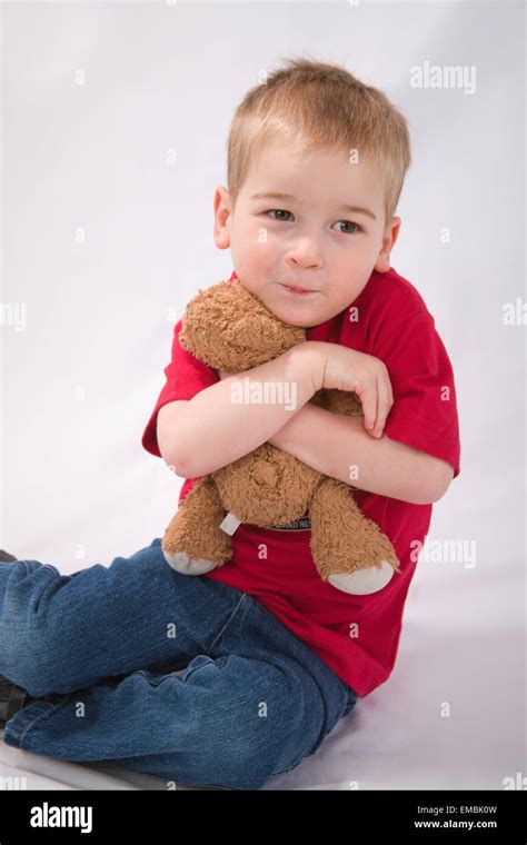 Three Year Old Boy Hugging Teddy Bear Stock Photo Alamy