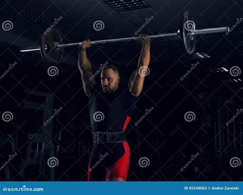 Weightlifter Lifts The Bar Above His Head Stock Image Image Of