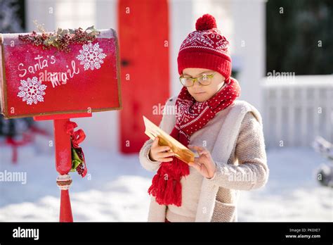 Happy Little Boy With Red Hat And Green Glasses Sending Her Letter To