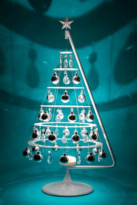 West elm's star burst christmas tree toppers channel a retro spirit, but also bring a bit of romance with that undeniably pretty gold and sparkly silver. Jubilee - Small Tree - Modern Christmas Trees