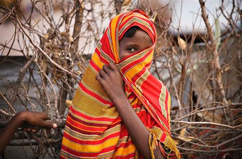 A Somali Refugee Girl Covers Her Face At Dagahaley Camp In Dadaab In