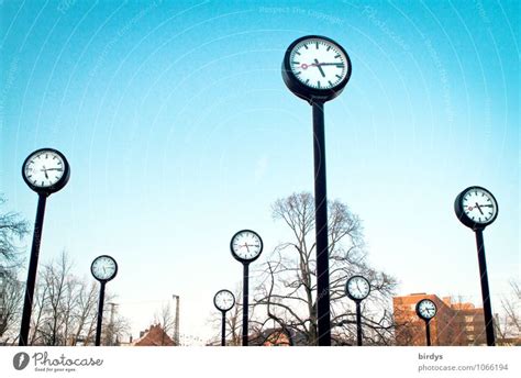 Clocks In The Uhrenpark Düsseldorf Bright Blue Sky A Royalty Free