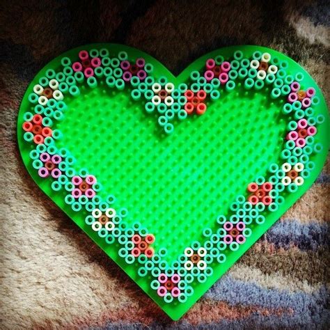 Check out our perler bead patterns selection for the very best in unique or custom, handmade pieces from our jewelry making & beading shops. Floral heart frame perler beads by rachel_blake_9 | Perler ...