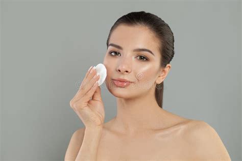 Healthy Spa Model Woman Removing Makeup From Her Face With Cotton Pad