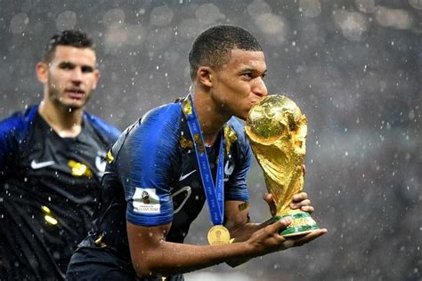 Teenage sensation kylian mbappe kisses the world cup trophy. Over 3.5 billion people worldwide watched 2018 FIFA World ...