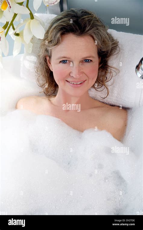 Mature Woman Enjoying Bubble Bath Stock Photo Alamy