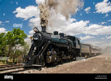 Old Fashioned Vintage Locomotive Train Engine Moving On Tracks Stock