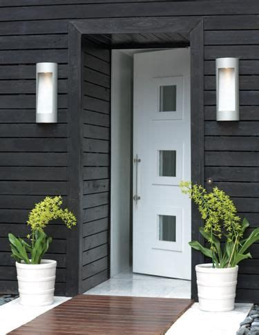 Install a coordinating pair on either side of the console table in the entryway to add a little illumination. Modern Outdoor Wall Sconce | Home Lighting Design