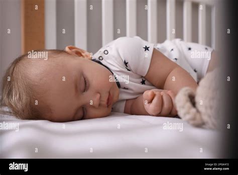 Adorable Little Baby Sleeping In Crib Closeup Stock Photo Alamy