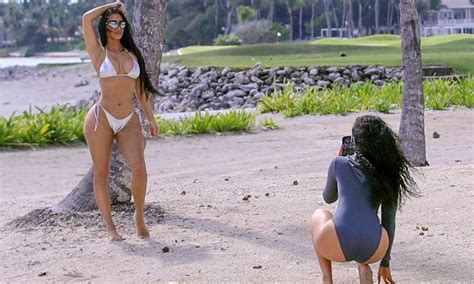 kim kardashian takes pictures in new skims swimwear