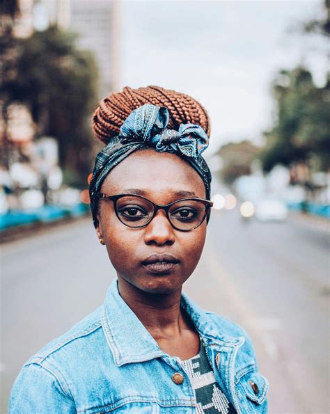 Selective Focus Photography Of Woman Wearing Blue And Multicolored