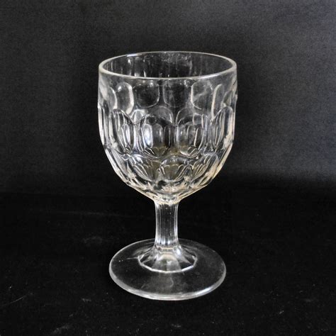 Pressed Glass Water Goblet In The Thumbprint Pattern Antique
