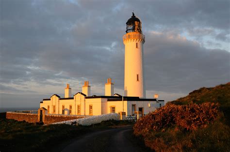 Golden Sunrise At The Mull Of Galloway Lighthouse Scotlands Most