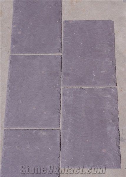 Boulders are cut into blocks, then visually inspected at each stage of production: Purple Slate Roofing Tile from China - StoneContact.com