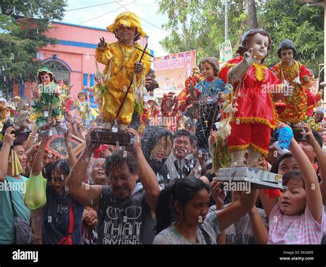 Catholic Devotees Soaked In Holy Water With Their Sto Niños During The