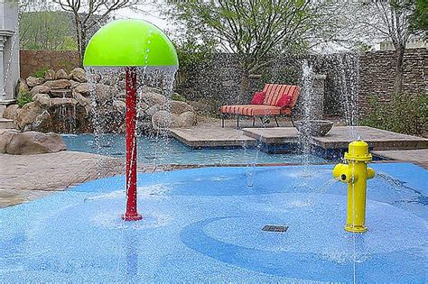 Should You Be Getting A Backyard Splash Pad Instead Of A Pool