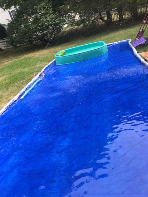 We loved using the slip n slide because it also sprayed. Backyard splash pad One tarp with pool noodles rolled and ...