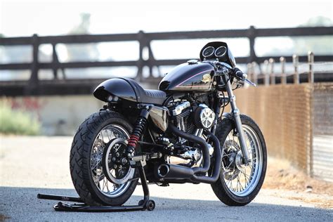Café racers were standard production bikes that were modified by their owners and optimized for speed and handling for quick rides over short distances. Harley-Davidson Sportster Cafe Racer