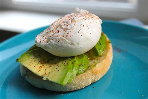 Homemade Poached Egg And Avocado On Toasted Sourdough English Muffin