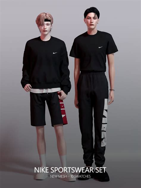 Two Young Men Standing Next To Each Other Wearing Nike Shorts And T