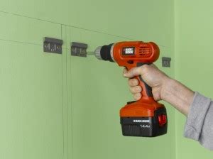 The space above the cabinets can be then easily hidden behind the tiles. Fitting kitchen wall units