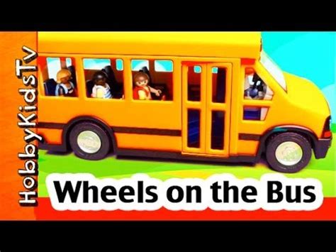 The wheels on the bus go round and round, round and round, round and round. Wheels on the Bus Toy and SONG with HobbyKidsTV - YouTube