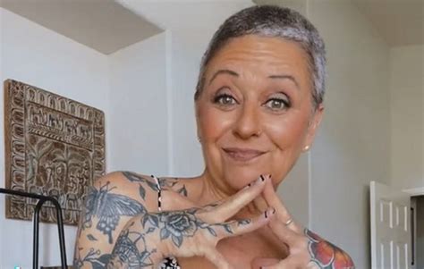 she is 58 years old and boldly decorates her body people say she s too old for tattoos 247