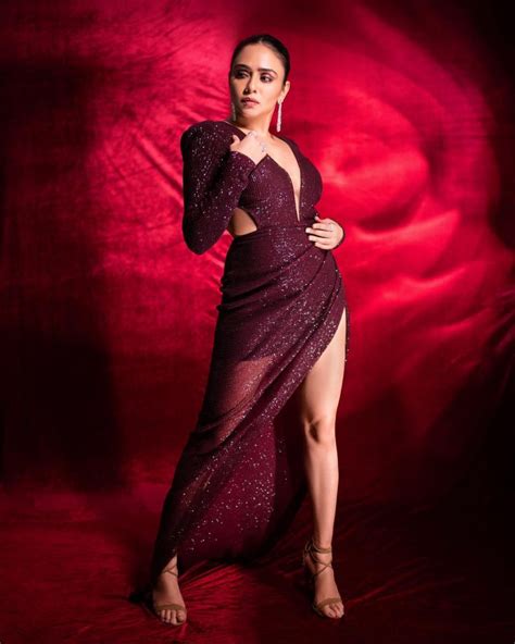 amruta khanvilkar raises sensuousness in thigh high slit dresses take cues