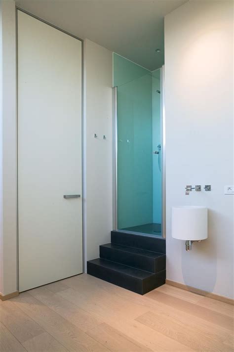 Hang pots from a ceiling rack to divide the kitchen from another space. Huge interior door from floor to ceiling (3m height ...