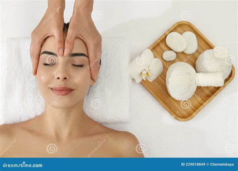 Young Woman Receiving Facial Massage In Spa Salon Top View Stock Image Image Of Aroma Face