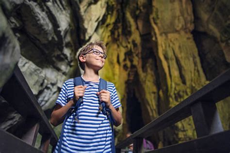 Kids Exploring Cave Stock Photos Pictures And Royalty Free Images Istock