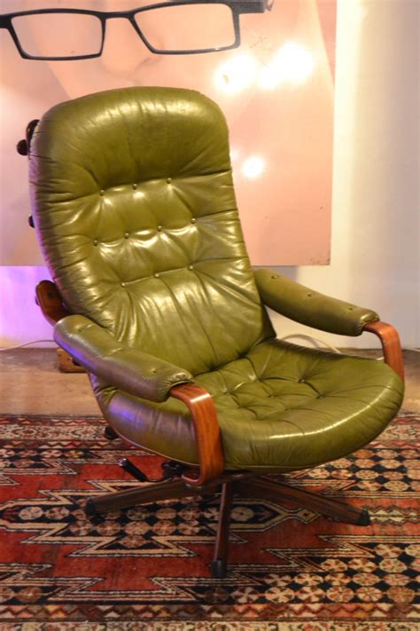 Add an ottoman and you are in the business of relaxation. Swedish Green Leather Swivel Chair and Ottoman by Göte ...