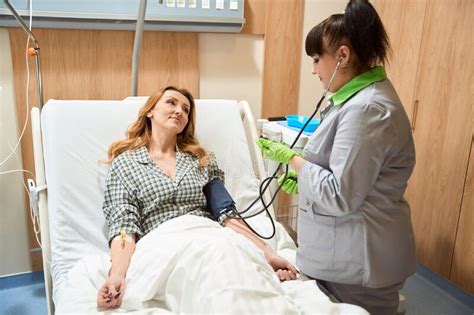 Lady Resting In Hospital During Treatment Looking At Doctor Stock Image Image Of Pressure